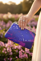 Electric Blue Leaf Clutch – Floral Bokeh Background