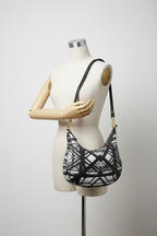Hot Metal Curve Hobo Bag Hanging from Mannequin Arm Studio Mockup