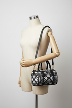 Hot Metal Mini Denbigh Duffle Bag Hanging from Mannequin Arm Studio Mockup