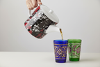 Mad Blossom Bone China Teapot Pouring into Moroccan Tea Glasses Studio Mockup