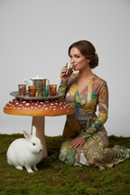 Wonderland Wrap Dress Model Drinking Tea with Rabbit Toadstool Table Studio Mockup